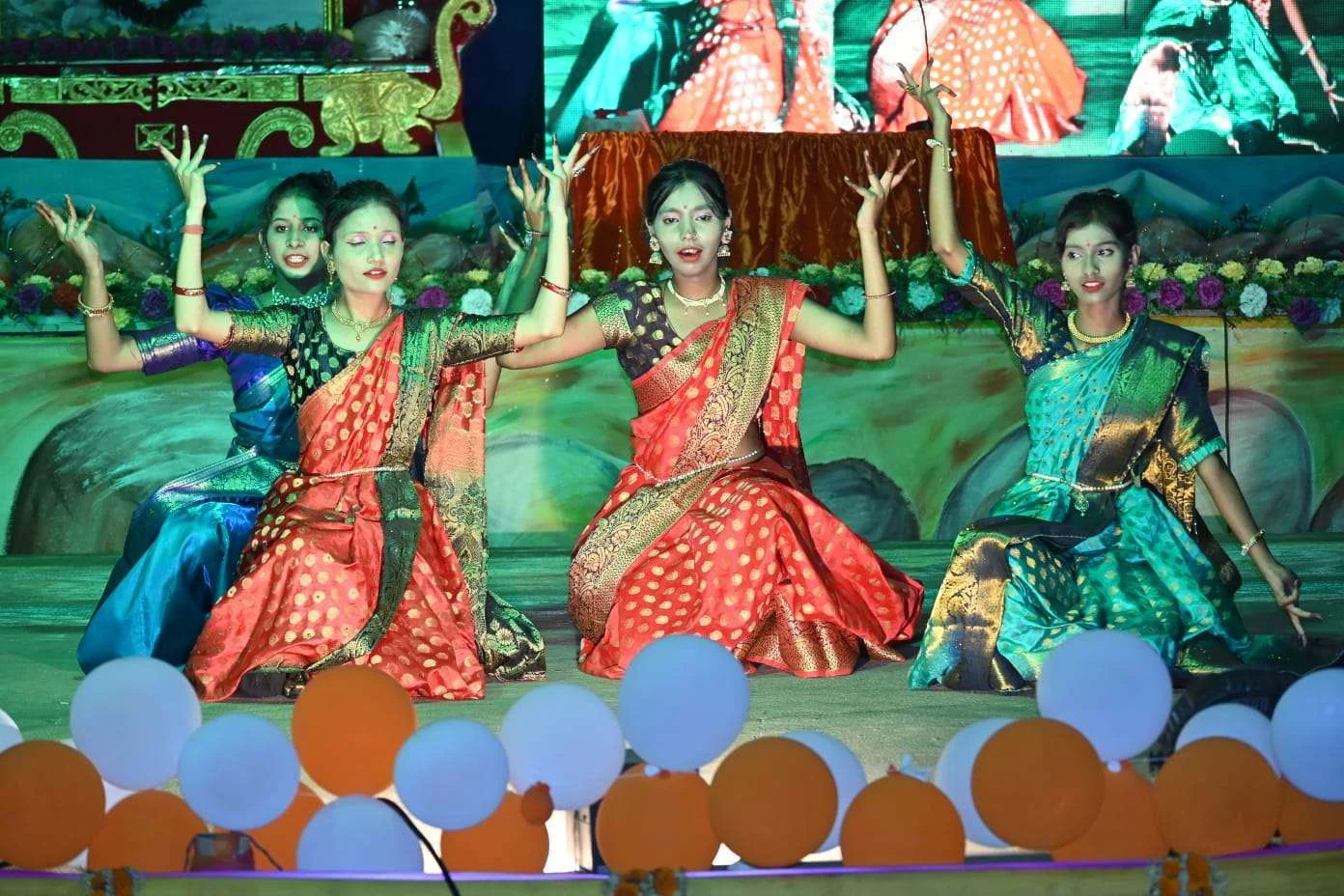 Traditional dancers performing together in the RAWA gallery